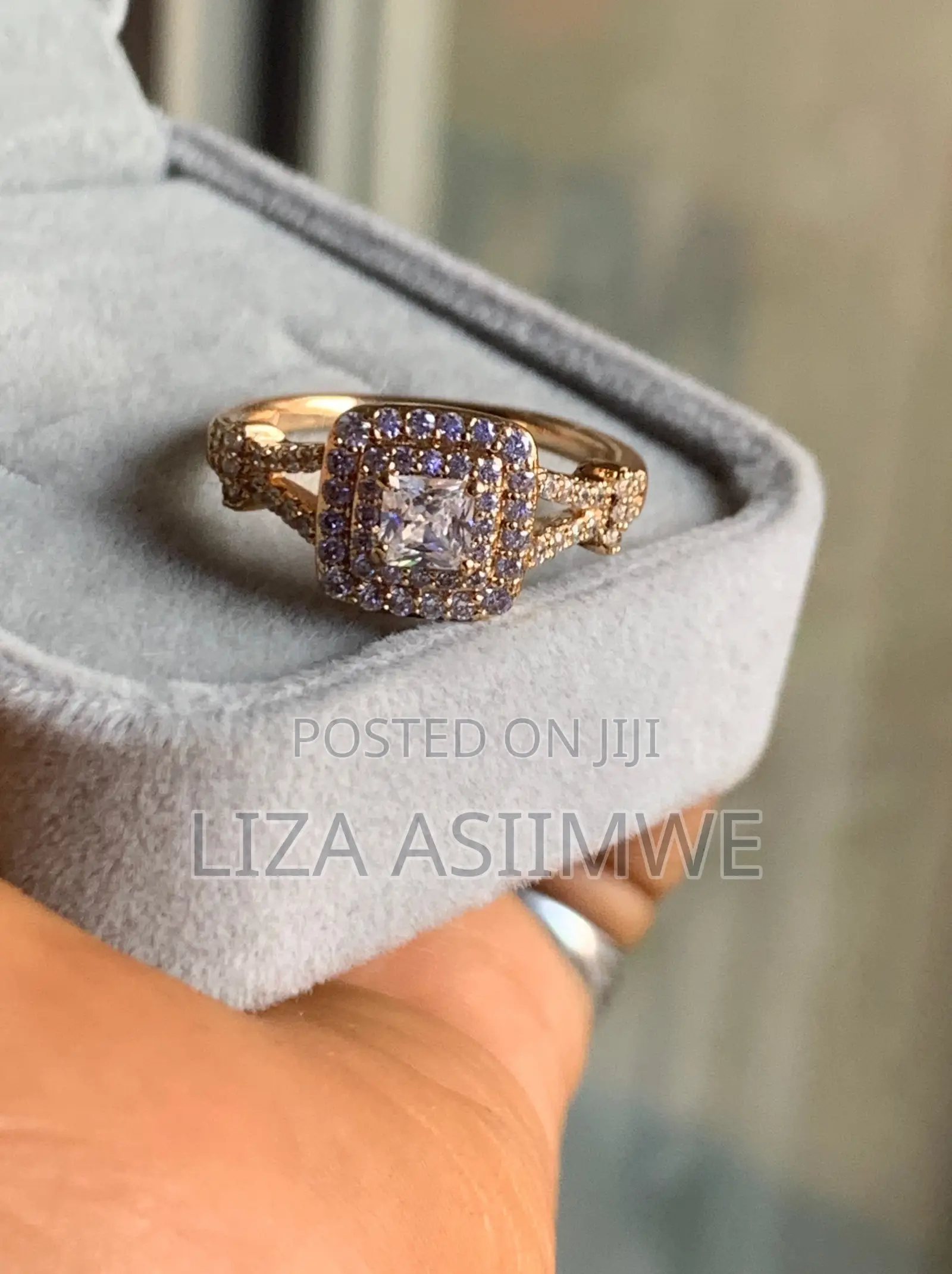 Square Engagement Ring With a Striking Double Halo and a Twisted Band.