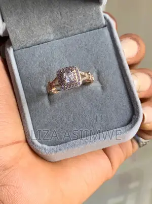 Square Engagement Ring With a Striking Double Halo and a Twisted Band.