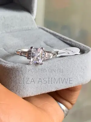 Engagement Ring With a Radiant Cut by Side Baguette Small Pave Stones