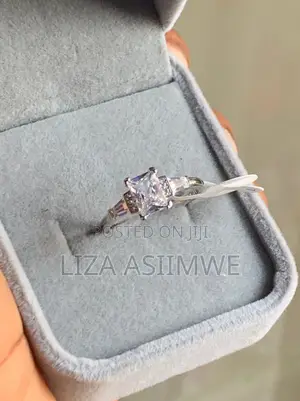 Engagement Ring With a Radiant Cut by Side Baguette Small Pave Stones