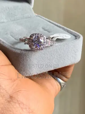 Three-Stone Cushion Halo Engagement Ring