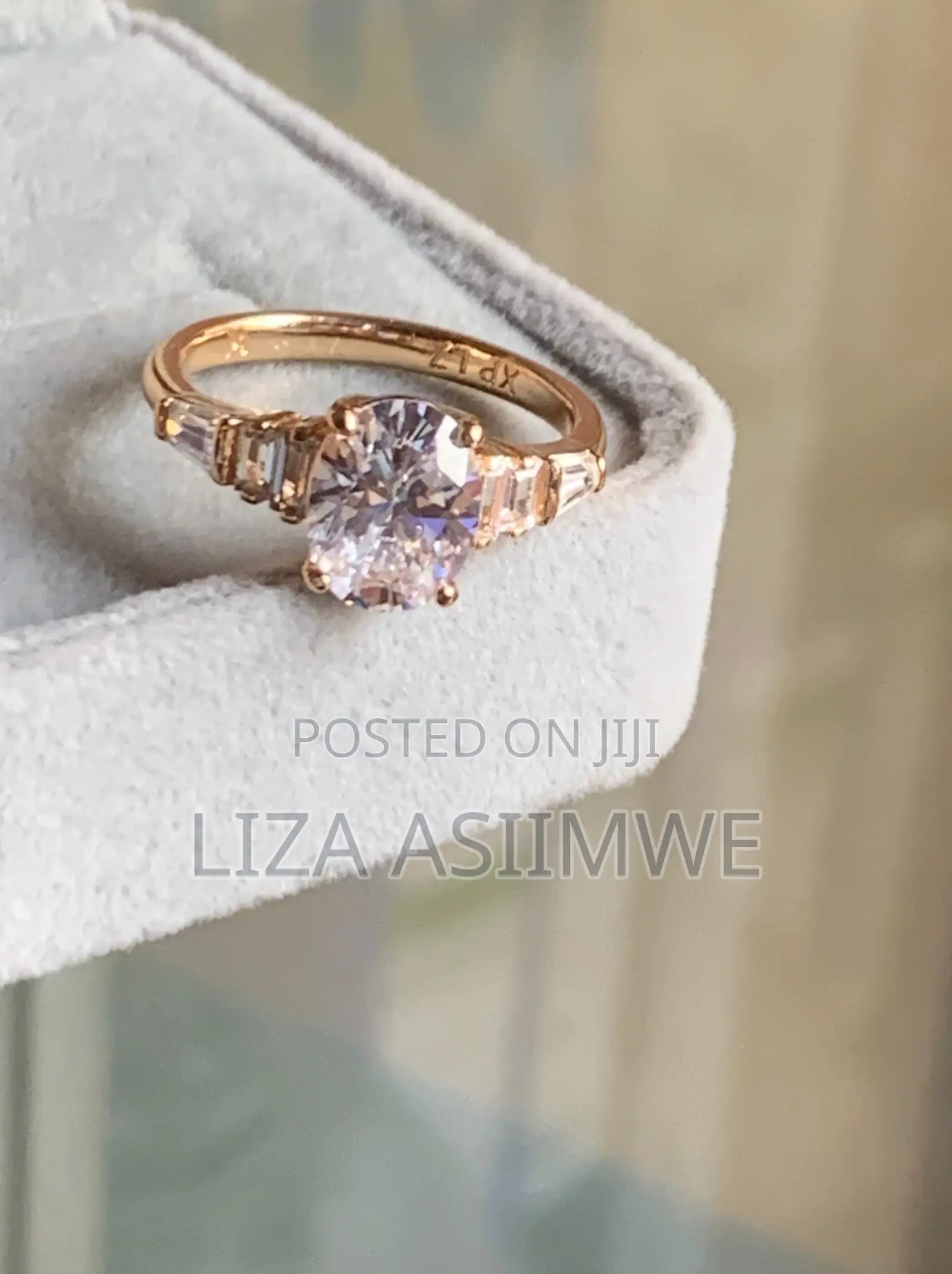 Oval-Cut Rose Gold Engagement Ring With Elegant Graduated Side Stones