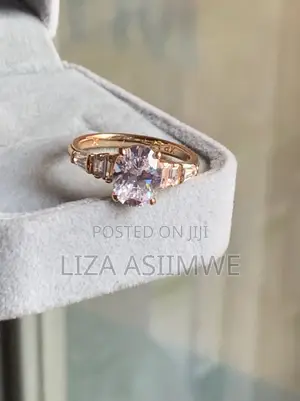 Oval-Cut Rose Gold Engagement Ring With Elegant Graduated Side Stones