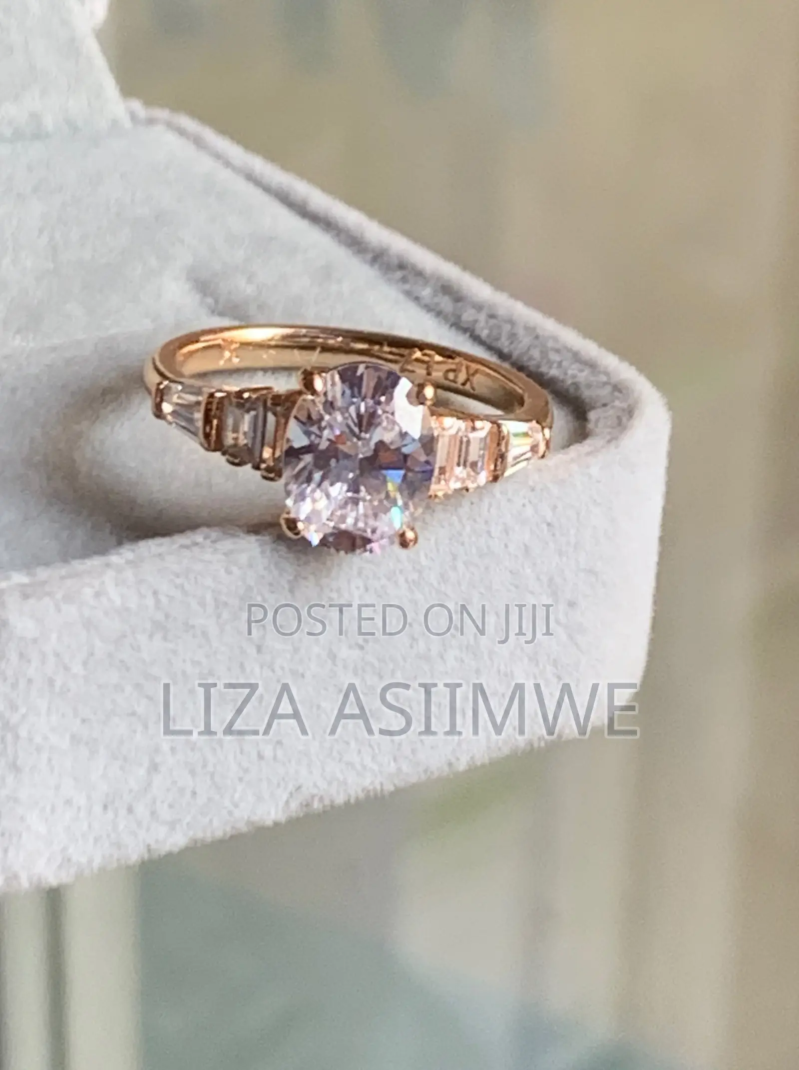 Oval-Cut Rose Gold Engagement Ring With Elegant Graduated Side Stones