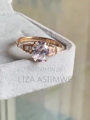 Oval-Cut Rose Gold Engagement Ring With Elegant Graduated Side Stones