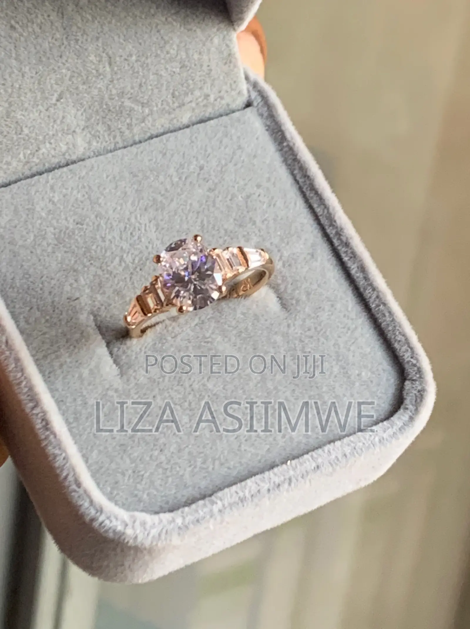 Oval-Cut Rose Gold Engagement Ring With Elegant Graduated Side Stones