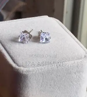 Square Silver-Toned Stud Earrings With a Clear, Faceted Stone Set