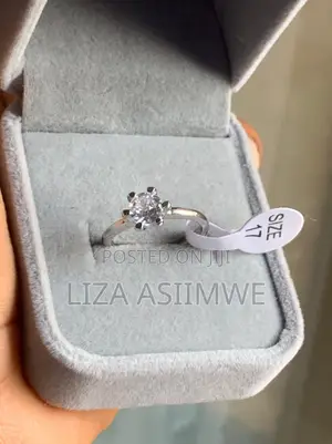 Silver Solitaire Engagement Ring With a Round Center Stone