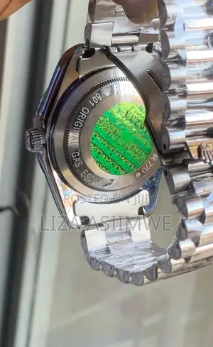 Silver Metal Rolex Watch With a Black Dial With Crystal Hour Markers