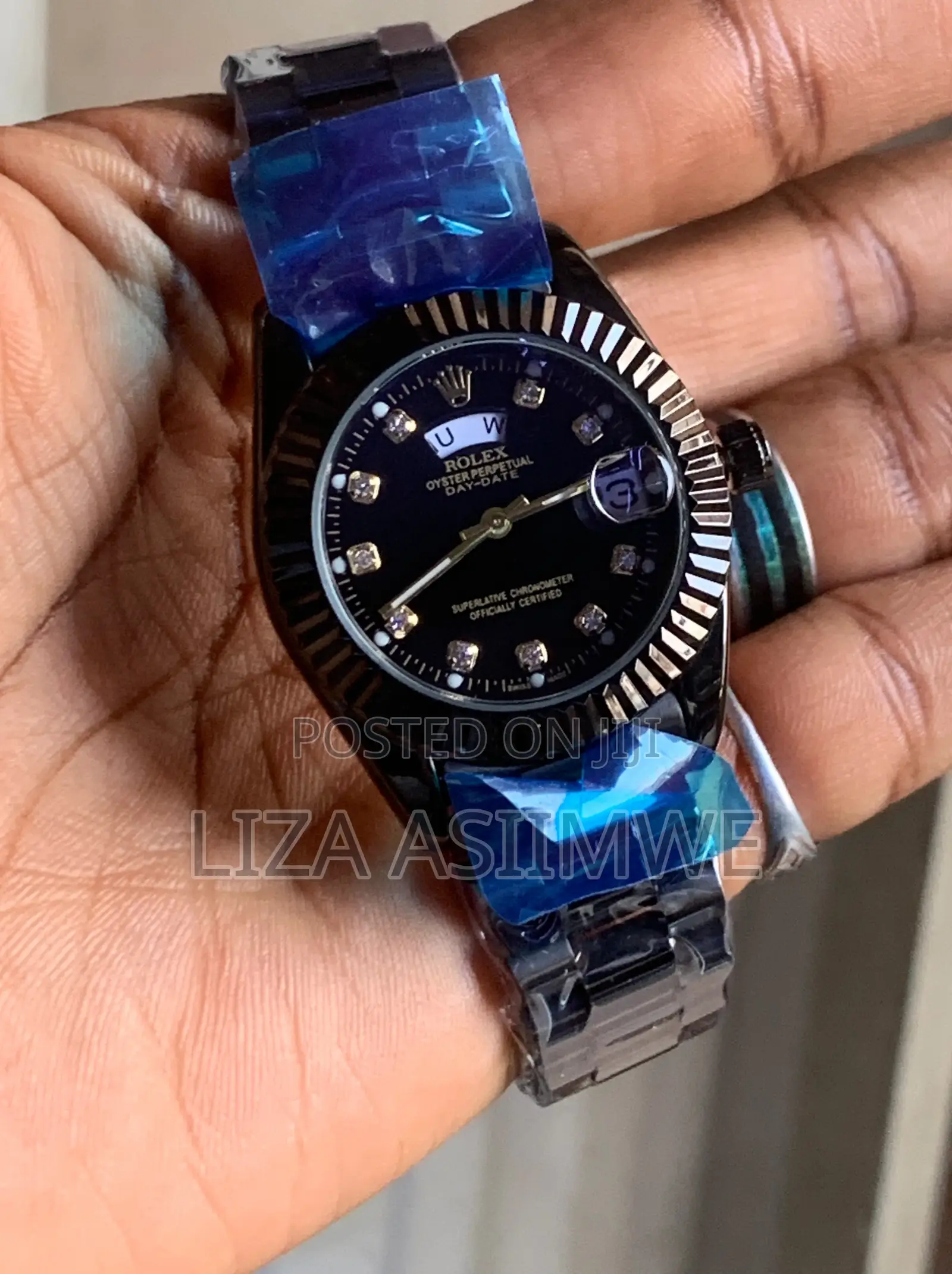 Black Rolex Oyster Perpetual Day-Date Style Watch With a Fluted Bezel