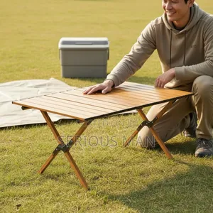 Folding Camping Table Featuring a Light Wooden Roll-Up Slat Top