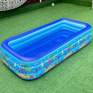 Inflatable Swimming Pool Set Up on a Green Lawn.