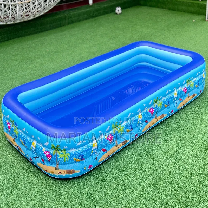 Inflatable Swimming Pool Set Up on a Green Lawn.