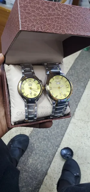 Police Analog Wristwatch Featuring a Bright Gold-Toned Dial