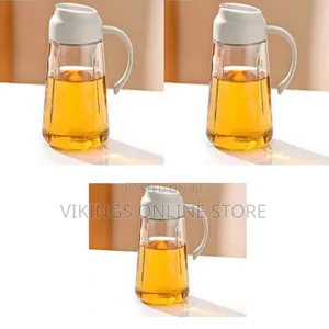 Auto-Flip Glass Oil and Vinegar Dispenser Bottle With a Light-Colored