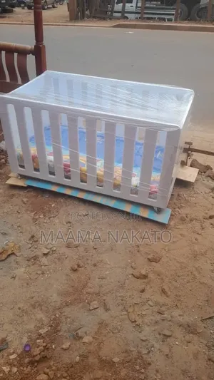 Baby Cot Available in White Color and a Mattress Call