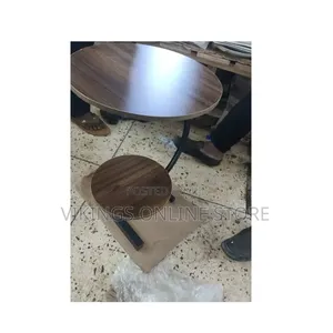 2-Piece Round Nesting Coffee Table Set With a Dark Walnut Wood Grain