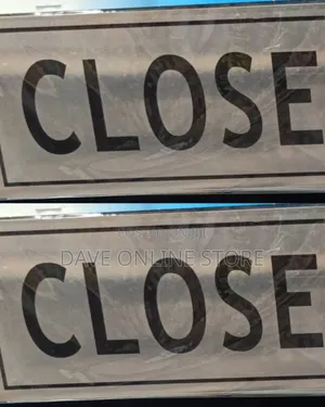 Silver-Colored Metal "CLOSE" Sign