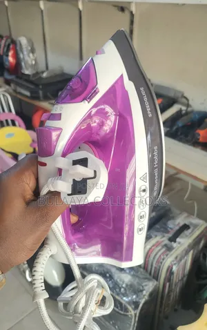 UK Used Russell Hobbs Speedglide Steam Iron in Purple and White, 2400w