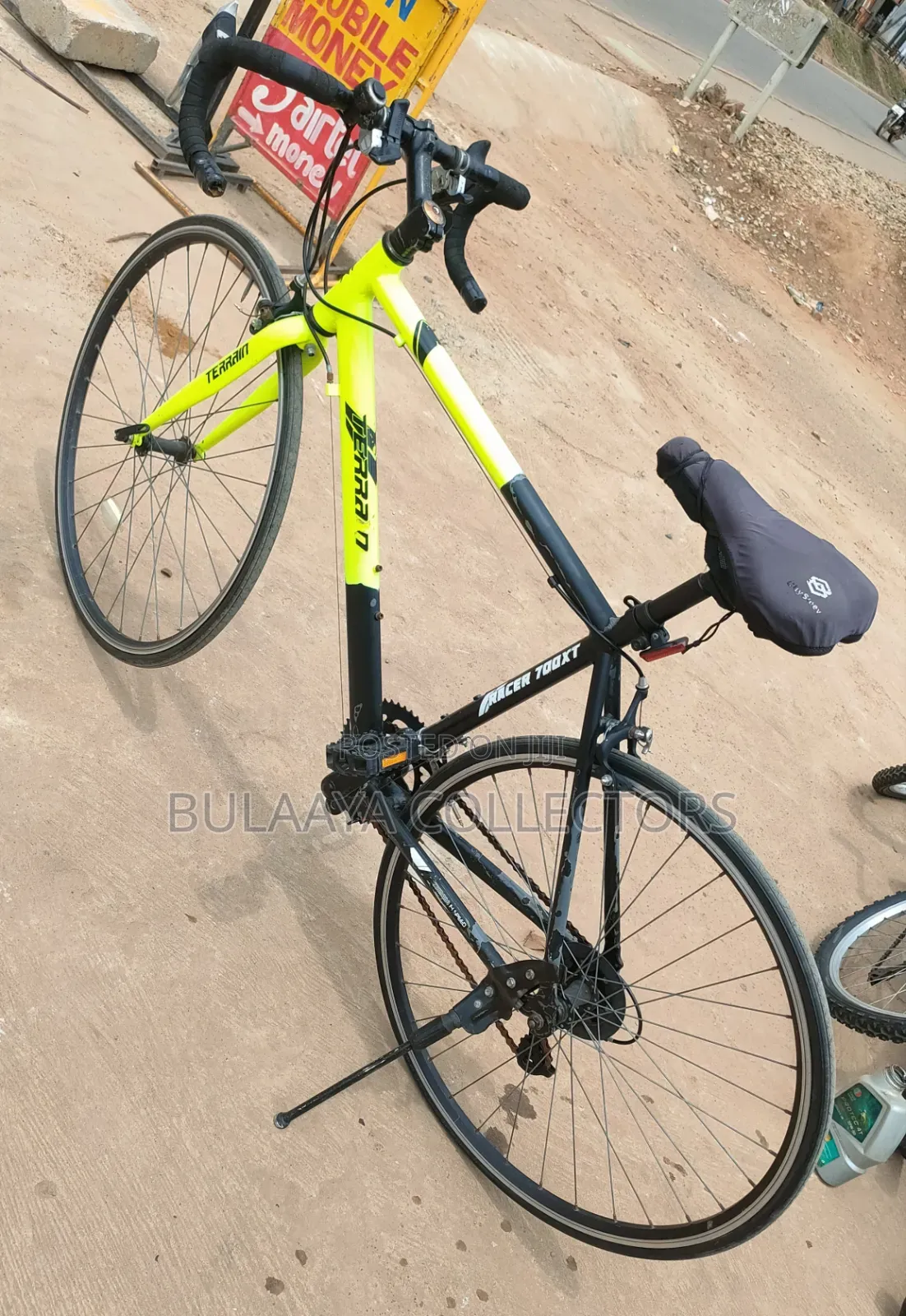 UK Black and Neon-Green Trinx Tempo Road Bike With Drop Handlebars.