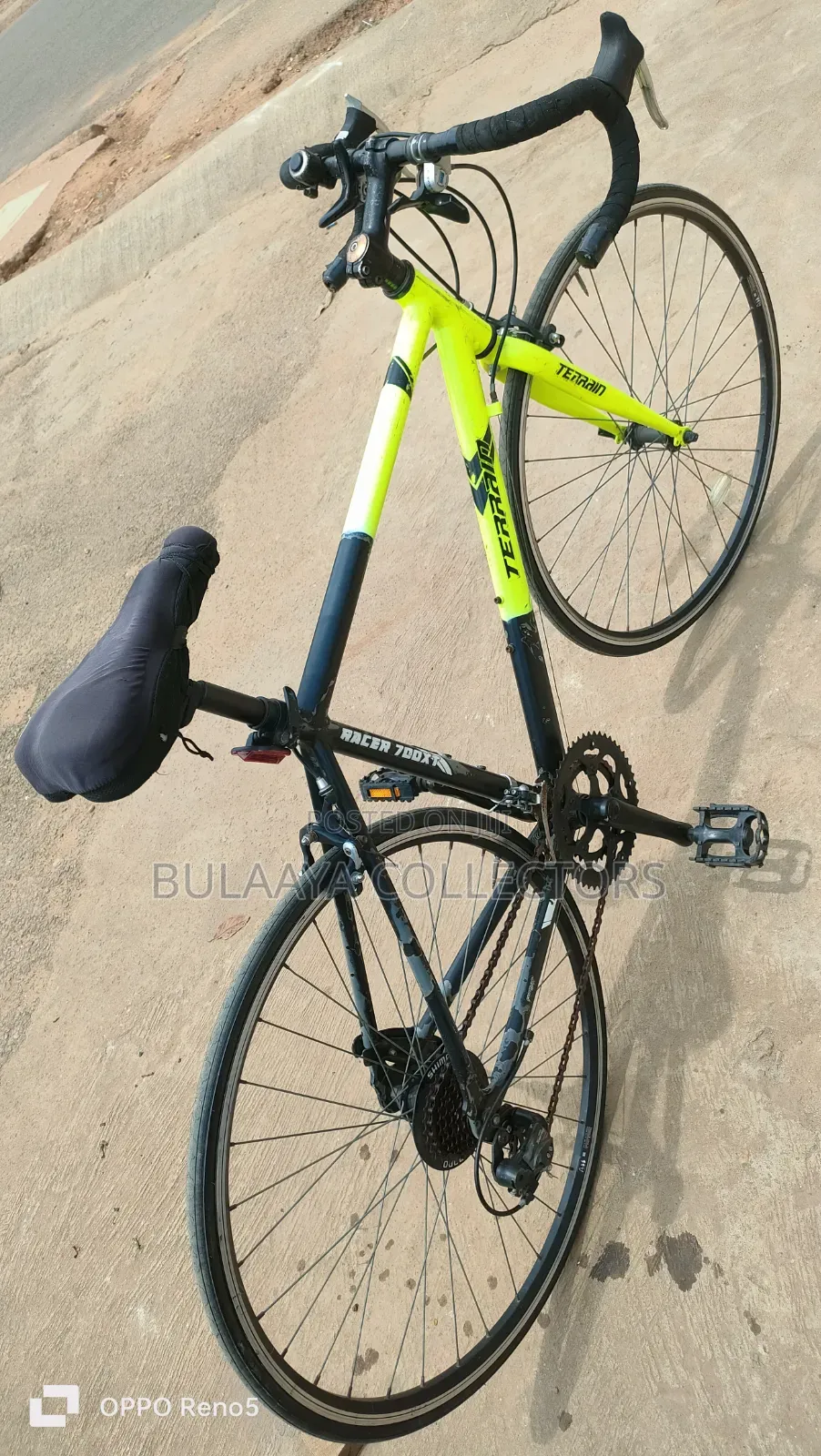 UK Black and Neon-Green Trinx Tempo Road Bike With Drop Handlebars.