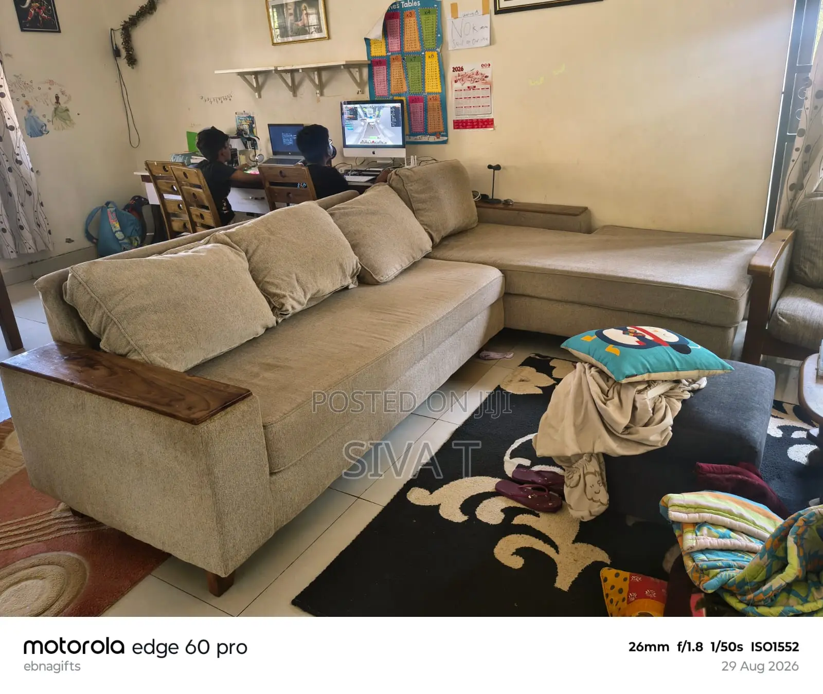 L-Shaped Sectional Sofa Featuring Dark Wooden Armrests