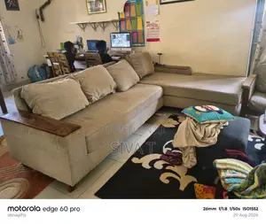 L-Shaped Sectional Sofa Featuring Dark Wooden Armrests