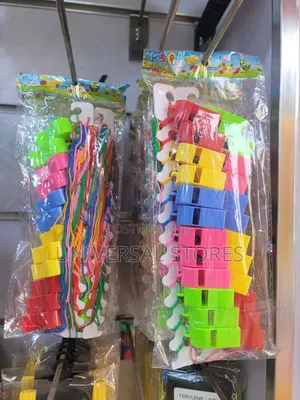 Packet of Colorful Plastic Toy Whistles Attached to Lanyards