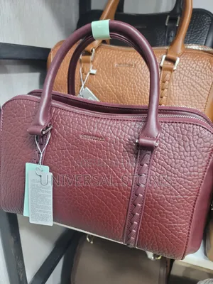 Chrisbella Handbag Featuring Dual-Texture, Metallic Handle Accents.