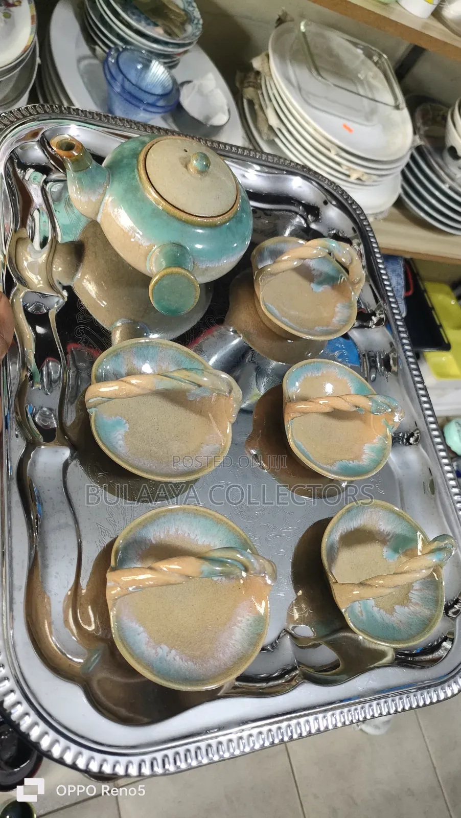 Japanese Ceramic Tea Set With a Tea Pot and Decorative Trinket Cups.