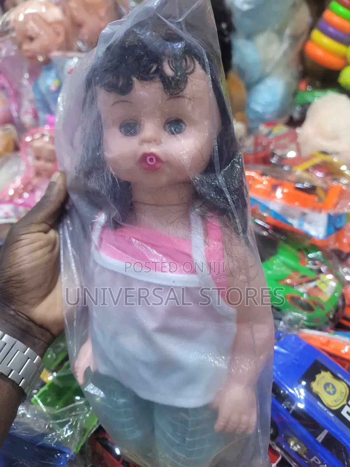 Dark Curly Hair and a Casual Pink Doll