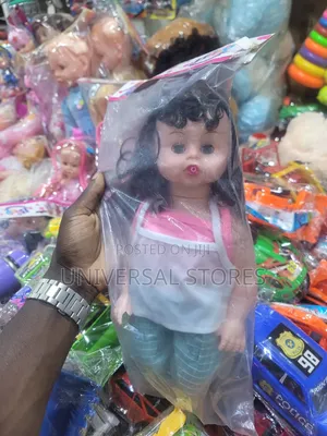 Dark Curly Hair and a Casual Pink Doll