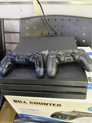 Uk Model Ps4 Pro With 10 Games Chipped and 2 Pads