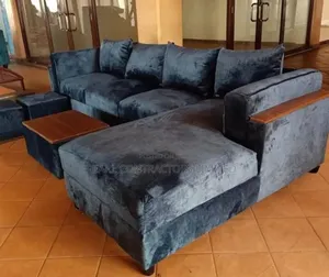 Sofas/Double Armed Lsofa With Center Piece and 2poufs.