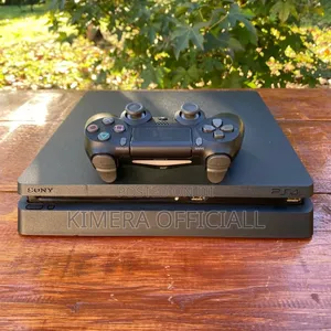 Original Chipped PS4 Slim 500GB — Loaded With 12 Heavy Games FC27, GTA