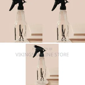 Transparent Plastic Hair-Spraying Bottle With a Black Trigger Spray
