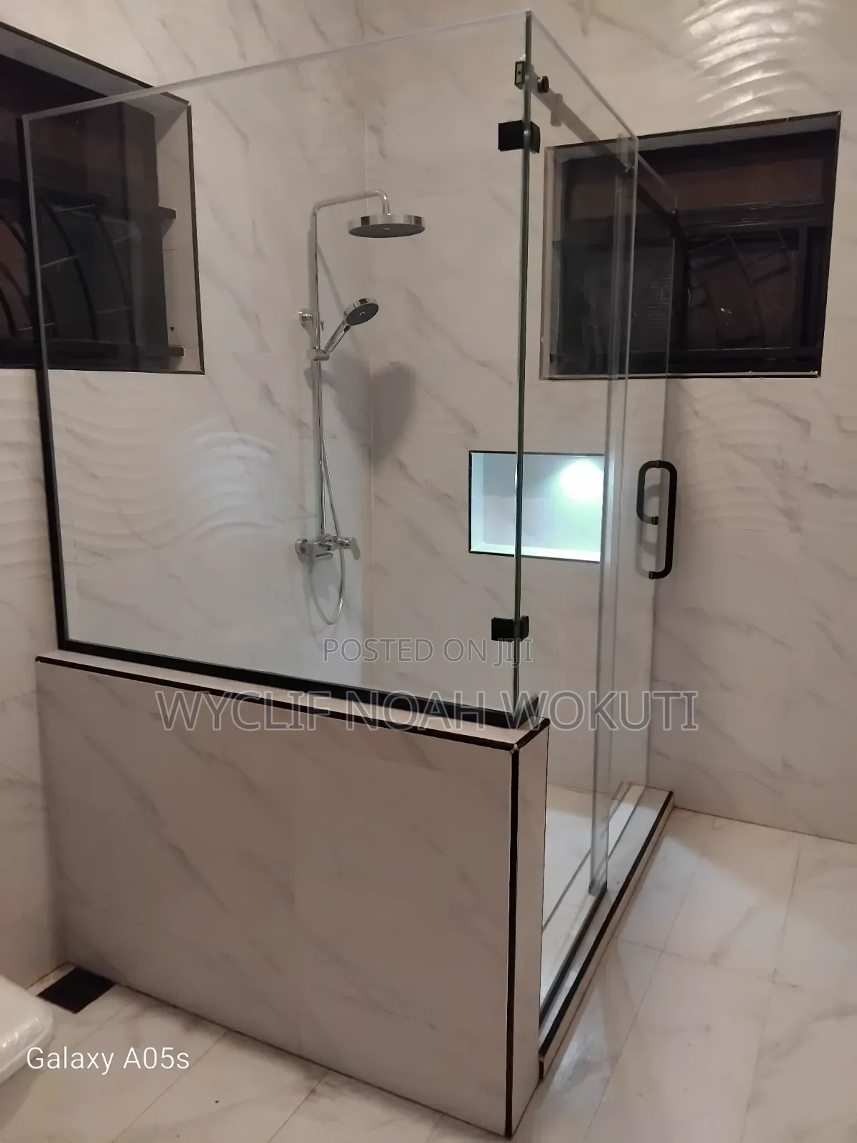 Clear Shower Cabin With a Sliding Shutter