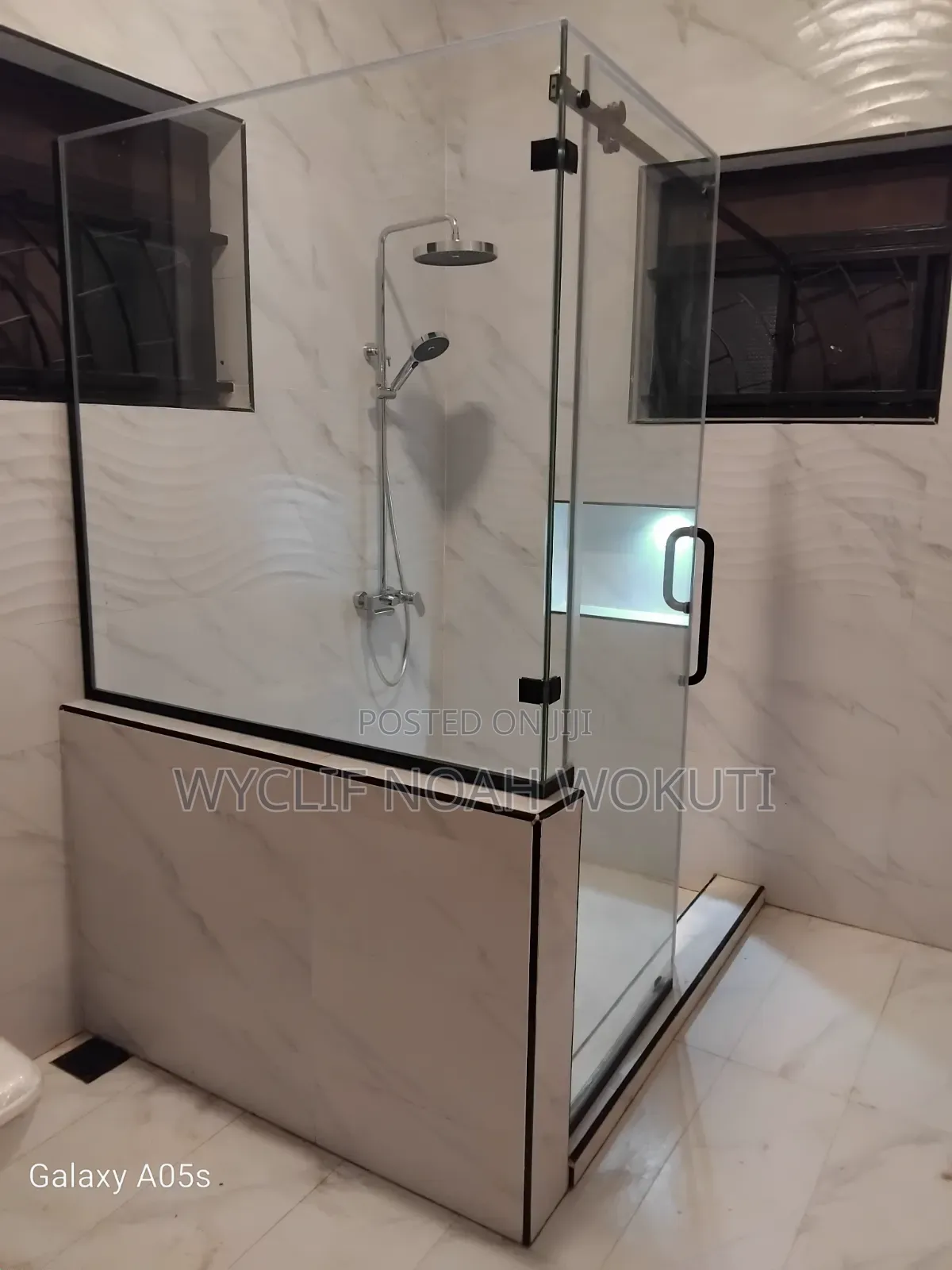 Clear Shower Cabin With a Sliding Shutter