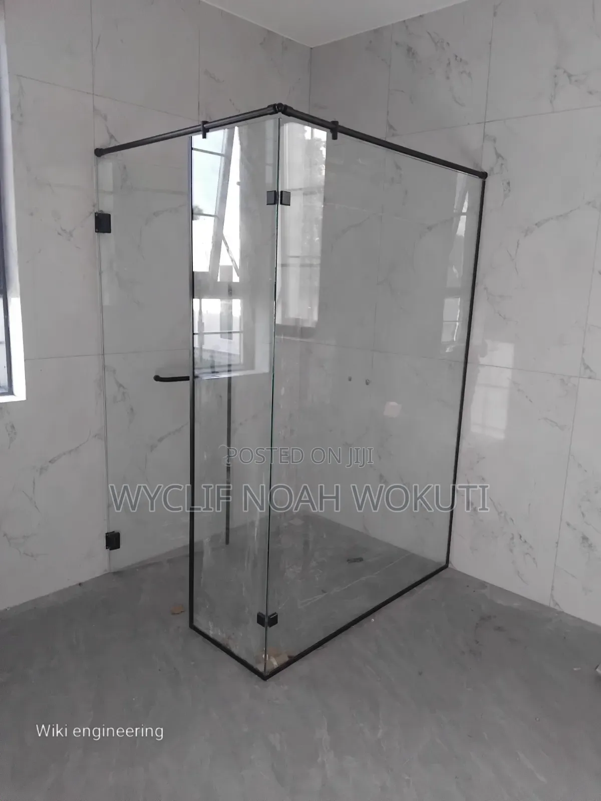 A Clear Shower Cabin With a Swing Door