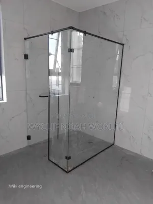 A Clear Shower Cabin With a Swing Door