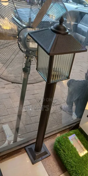 Outdoor Post Light, Fluted Glass Panels and a Textured Pyramid Cap.
