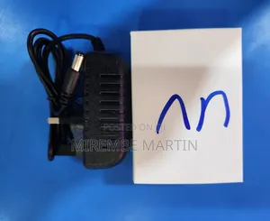 A Black AC/DC Power Adapter With a Barrel Connector