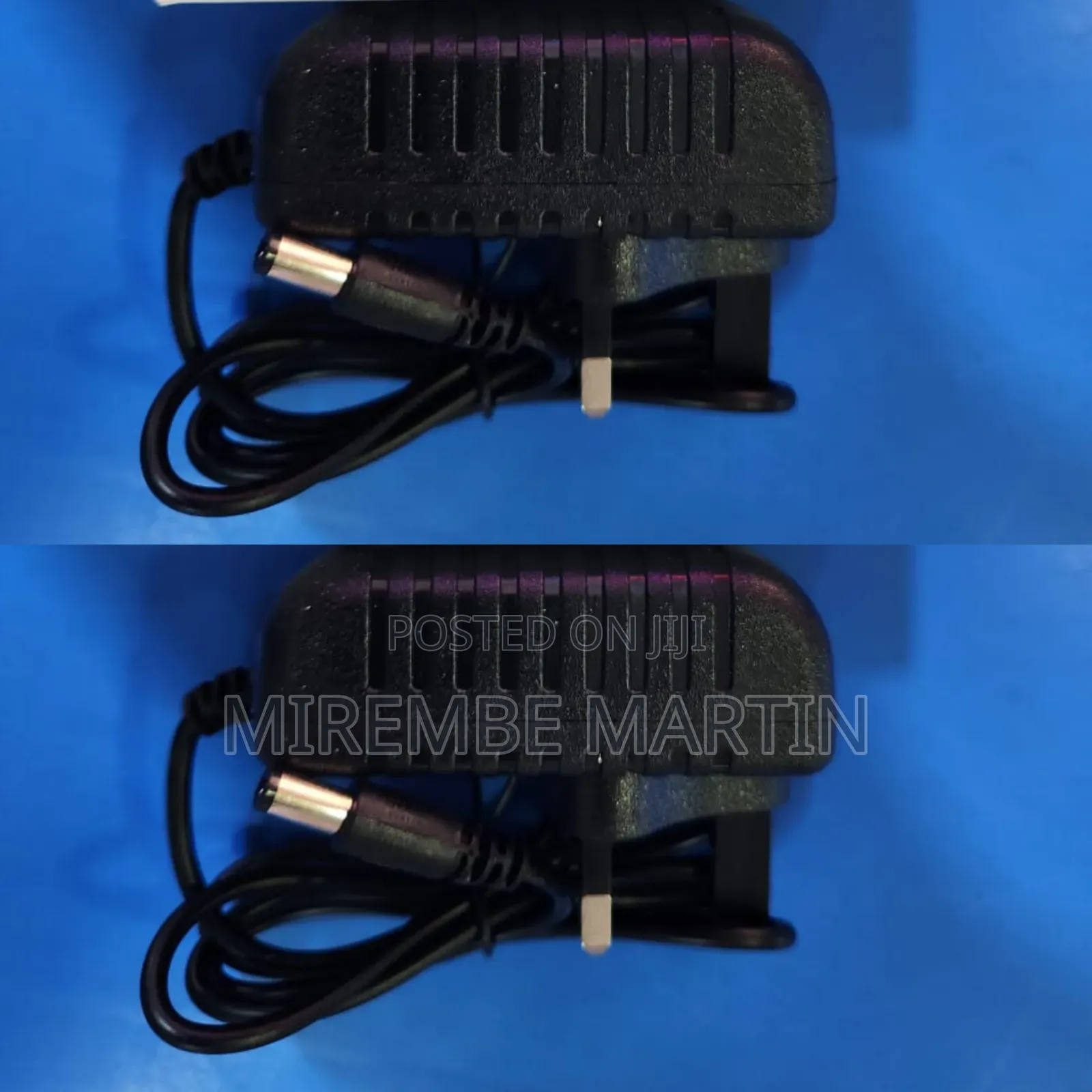 A Black AC/DC Power Adapter With a Barrel Connector