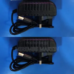 A Black AC/DC Power Adapter With a Barrel Connector