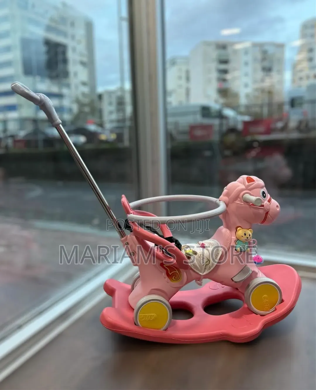 Kids' 4-in-1 Rocking Horse and Ride-on Toy With a Push Handle