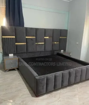 Beds/Upholstered Bed With Gold Strips and Side Tables.