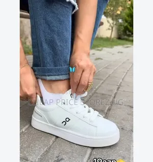 Clean White Casual Sneakers Feature a Distinct Logo on The