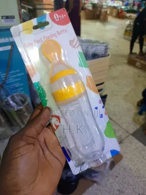 Squeeze-Style Baby Food Feeding Bottle With a Spoon