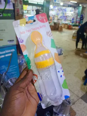 Squeeze-Style Baby Food Feeding Bottle With a Spoon