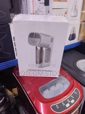 A 3-in-1 Portable Aspirating Garment Steamer & Vacuum Cleaner.